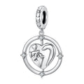 Silver pendant with heart design and small figure, on a white background