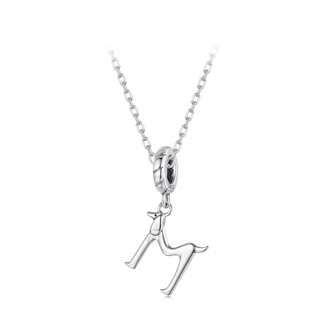 Silver charm shaped like a dog on a white background