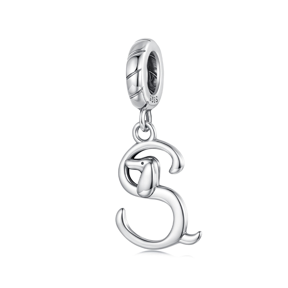 Silver dog charm on a white background
