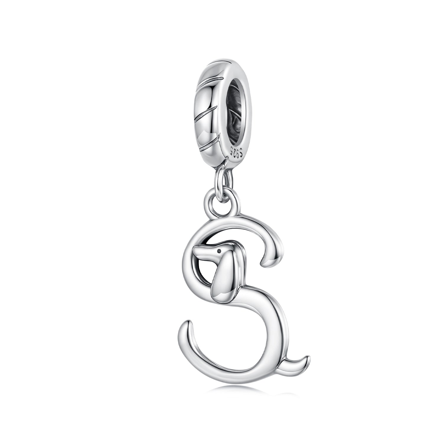 Silver dog charm on a white background