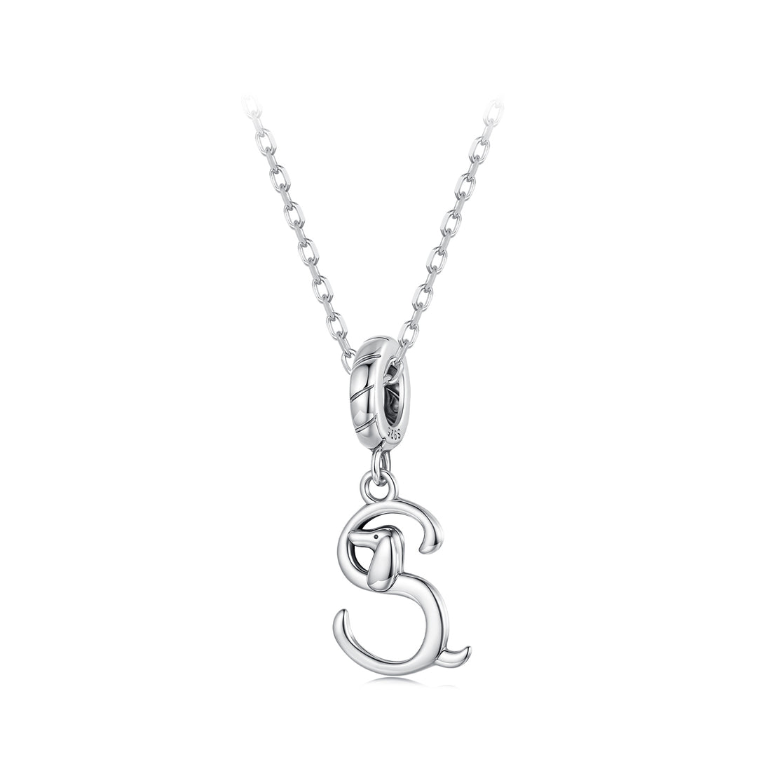 Silver dog charm on a white background