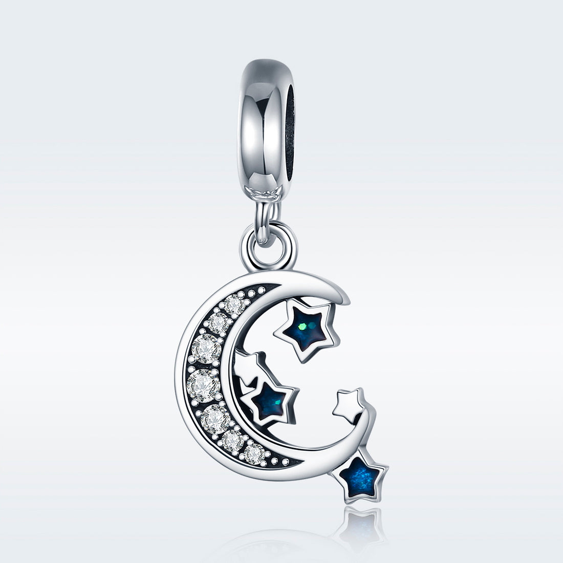 Silver pendant with moon and star design on a light gray background