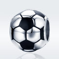 Silver soccer ball charm on a light gray background