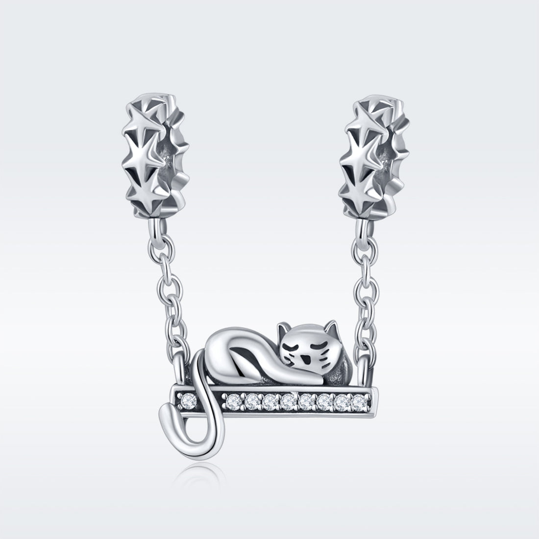 Silver cat charm on a chain with a white background