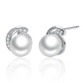 Pearl stud earrings with silver and diamond accents on a white background
