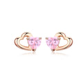 Heart-shaped earrings with pink gemstones and rose gold frames on a white background