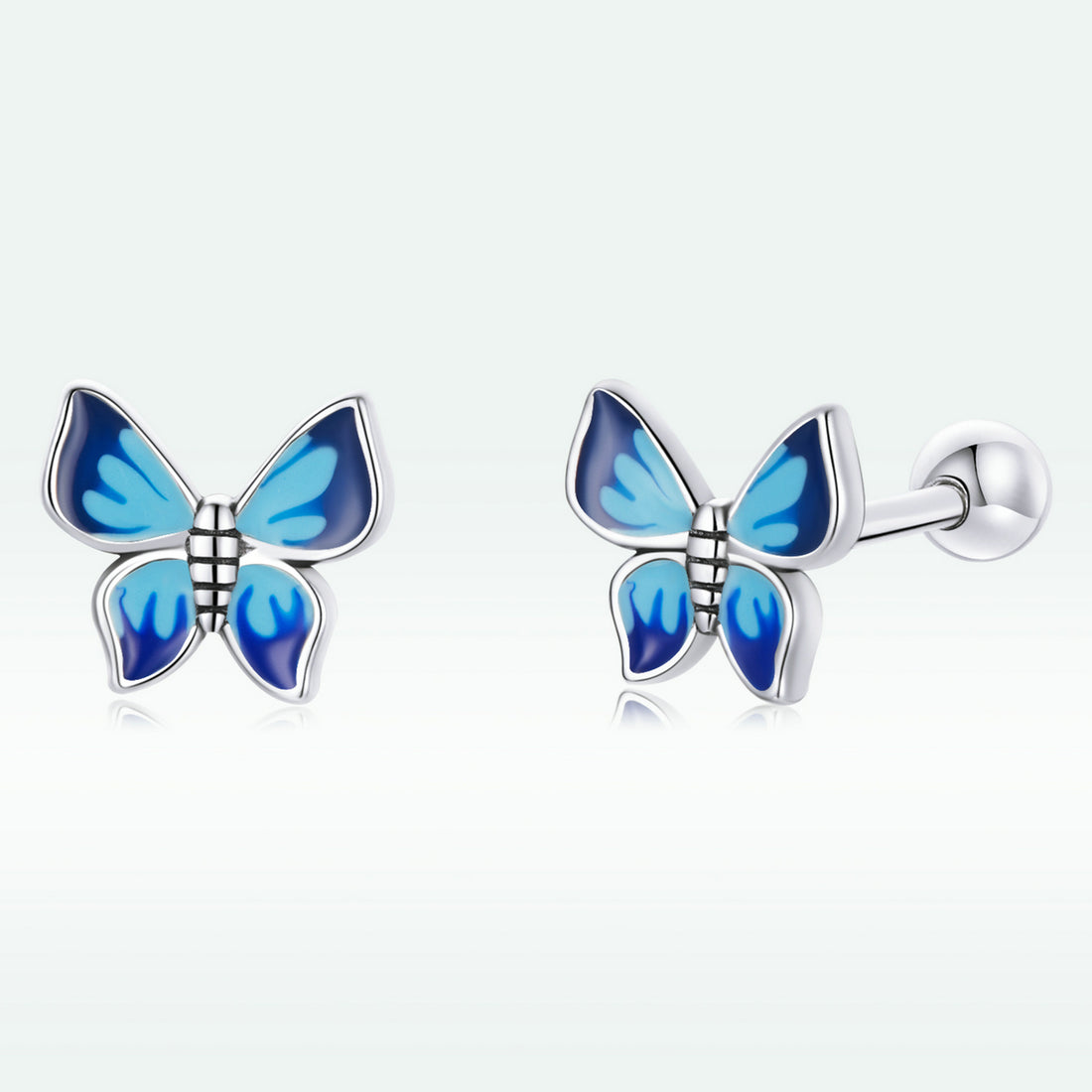 Butterfly-shaped earrings with blue wings on a white background