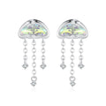 Heart-shaped cloud earrings with dangling crystals on a white background