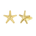 Gold starfish earrings on a white background