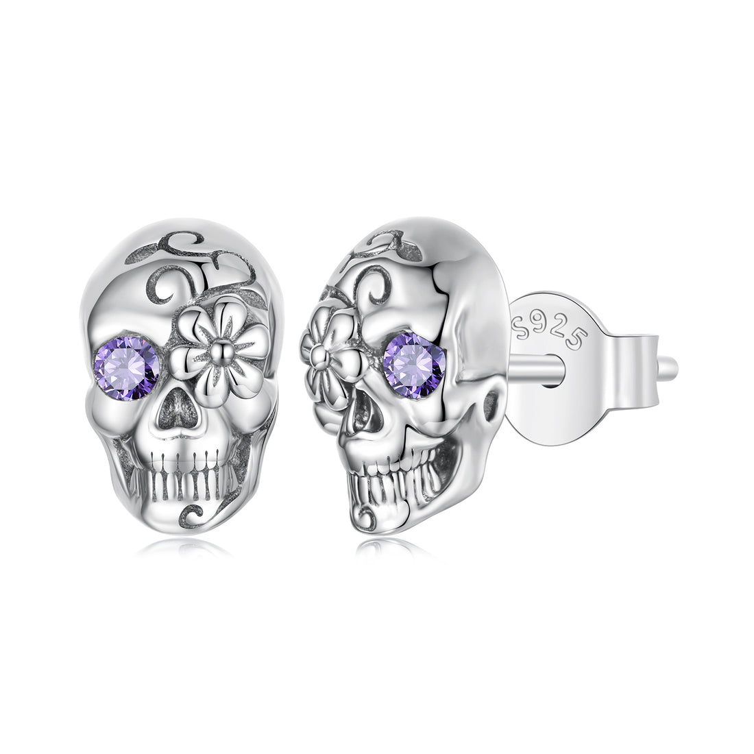 Silver skull earrings with purple gemstones on a white background