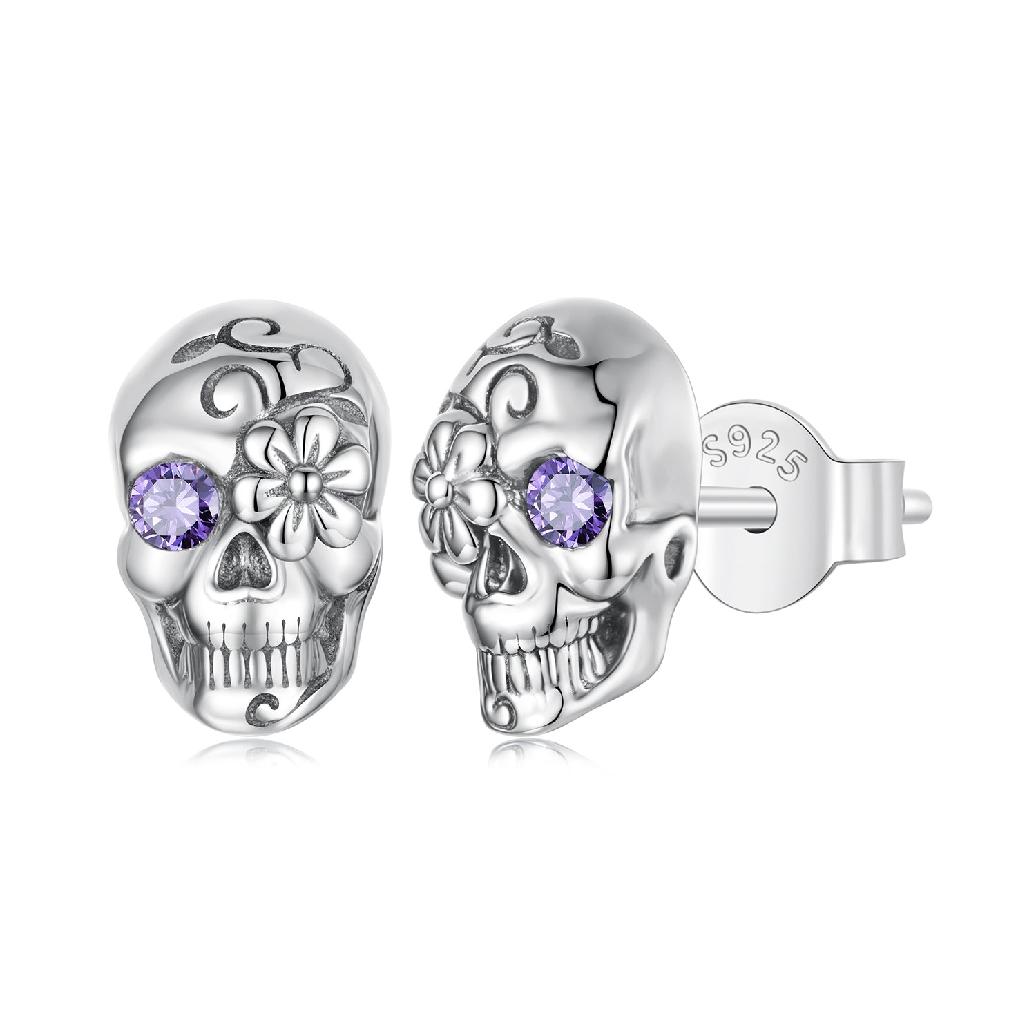 Silver skull earrings with purple gemstones on a white background