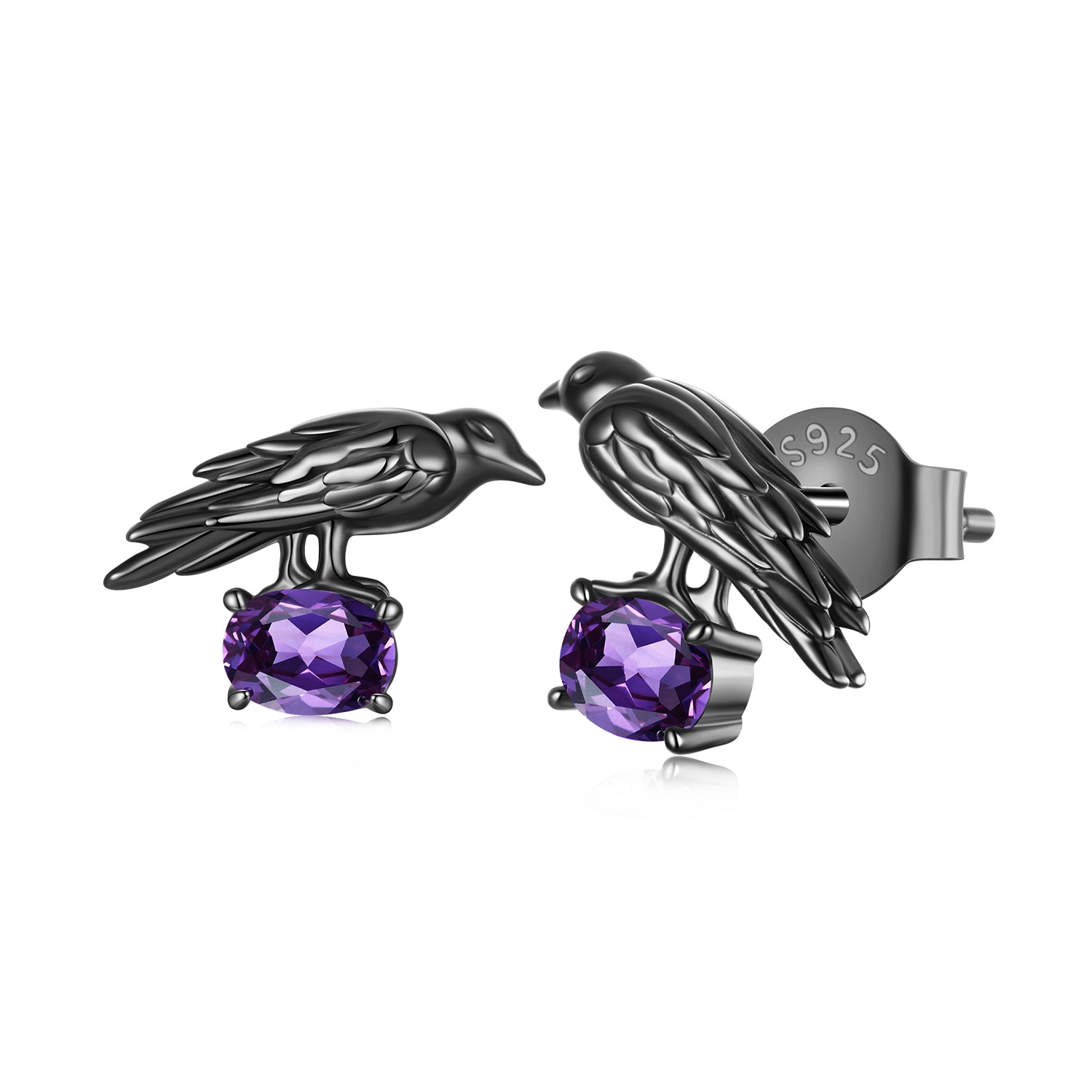 Black bird-shaped earrings with purple gemstones on a white background