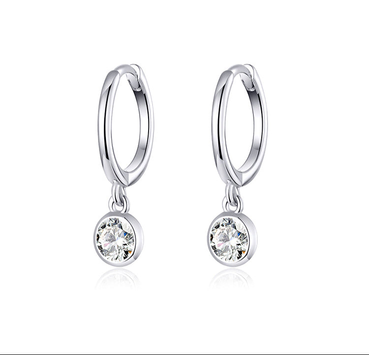 Silver zirconia ear clips on a white background with text 'As Unique As You' and 'Zirconia Ear Clip'.