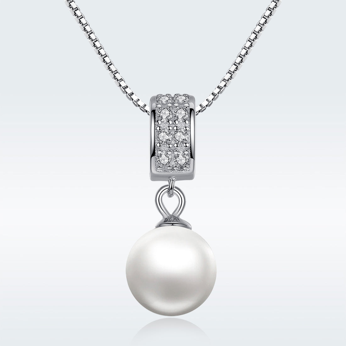 Pearl necklace with diamond pendant on a white background