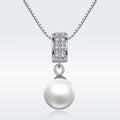 Pearl necklace with diamond pendant on a white background