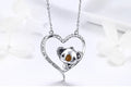 Silver necklace with a koala pendant on a white background