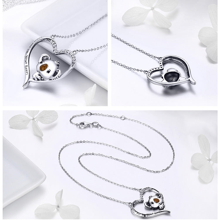 Silver necklace with a koala pendant on a white background