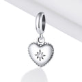 Silver heart-shaped pendant with a star design on a white background
